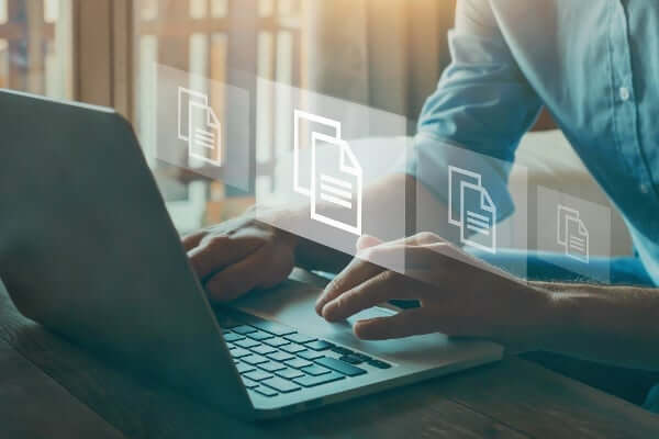 Photo of an online learner examining course materials