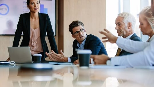 Photo of a group of people having a business meeting