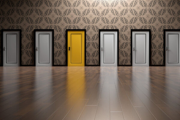 Photo of a line of mysterious doors representing risk and opportunity